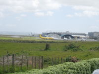  - View of cargo and biz jet apron from one of the viewing areas just to the east of the airport on the road to Manukau.

Good place for photos if landing towards the west. - by magnaman