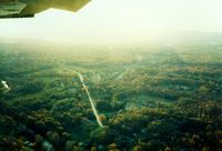  - Turning Right Base for Runway 24 over Red Oaks Mill at Dutchess County Airport, Poughkeepsie, NY - 1986  - by scotch-canadian