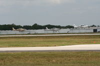  - Sun N Fun traffic at Lakeland, 3 SR 22s take off for demos - by Florida Metal