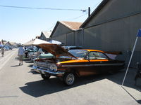  - First Sunday Aviation Museum of Santa Paula Open House & Fly-In invites car clubs-this is a Chevrolet hardtop coupe half-jacked with chromed hydraulics located in open trunk. - by Doug Robertson