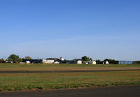  - An overview of the general aviation area of Monmouth Executive Airport (formerly Allaire), with the control tower. - by Daniel L. Berek
