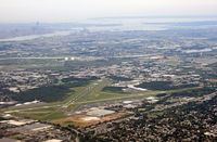  - With Teterboro Airport in the foreground (seen from the northern end, with the old tower and the Aviation Hall of Fame of New Jersey to the left, we have a panoramic view of Newark, Manhattan, the Hudson, and the Brooklyn Bridge. - by Daniel L. Berek