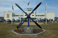  - Memorial featuring a Martin B-26 Marauder prop with the Grade II* listed art deco style Terminal  Building in the background - by Chris Hall