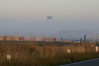  - Morning mist (Control Tower seen from RWY 25L) - by Daniel Vanderauwera