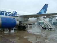  - A busy wet morning on the ramp at London's Gatwick Airport - by Ron Coates