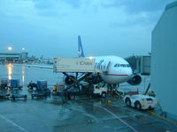  - A busy and wet evening on the ramp at Toronto's Lester B Pearson Int'l Airport - by Ron Coates
