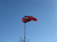  - Rwy 04 Windsock, a bit tattered in strong santana wind gusts-since replaced with new - by Doug Robertson