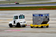 - Tug pulling cargo container O'Hare - by Ronald Barker