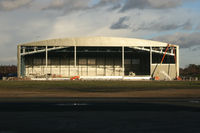  - Work continuing on the '747 hangar' (once the BASCO hangar). - by Howard J Curtis