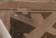  - Tracy in 1985. Tracy has some interesting winds, especially if you are flying a taildragger!! Believe it is why there were runways in so many directions. Somebody knew what they were doing. View is east. - by S B J
