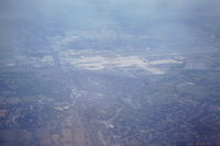  - From scanned slide taken early September 1990 from departing NorthWest Airlines flight to MSP.  View shows airport from the north about 15k altitude and climbing. - by Neil Henry