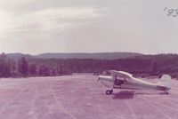  - N9078E at the north end of runway.View is to the SW, down the runway and to the lake. While not an absolute one way strip, it is best to take off toward the lake as most pilots do. - by S B J