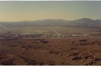  - Picture on downwind of Bullhead City airport in 1992. View is to the west and Laughlin,Nevada (casinos) across the river. Runway is barely seen in this picture. - by S B J