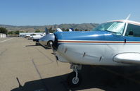  - A long line of local single engine pistons at Reid Hillview Airport, CA. - by Chris Leipelt