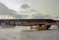  - From time to time, Fremont airport would go from a land base to a seaplane based airport. Unfortunately for Cub 30472, this was one of those times. The Fremont flight school is seen behind 472. They did not offer any floatplane instruction. - by S B J
