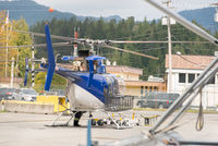  - Unknown helicopter in general setting of dry-land part of airport. Canadian Coast Guard base in background. - by Remi Farvacque