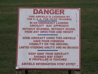  - sign next to public footpath style across runway! - by magnaman