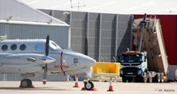  - Re-surfacing work underway at the Babcock MCS Offshore (formerly Bond Helicopters) apron at Aberdeen. Parked up is a visiting USMC UC-12W. - by Clive Pattle