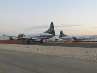  - Tankers 473 & 474 parked on the west end of NIFC ramp. - by Gerald Howard
