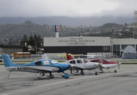  - Line-up of locally-based Cirrus SR20 + SR22 aircraft @ San Carlos Airport, CA (viewed facing west)  - by Steve Nation