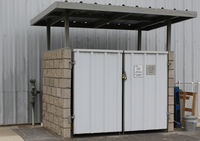 - Locked waste containers serving newer west section airport hangars. - by Doug Robertson