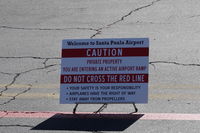 - Airport Caution Sign near Rwy 22/04 taxiway midfield Fuel Dock area - by Doug Robertson