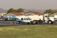  - N383SH 1983 Bell 206L-3 LongRanger III, Allison 250-C30P turboshaft 650 SHp, being serviced at SZP Thomas Fire FireBase. Note smoky sky. - by Doug Robertson