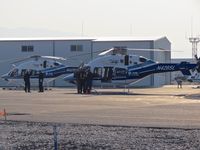  - Two St Luke's life flight helicopters parked on the Idaho Helicopter ramp. - by Gerald Howard