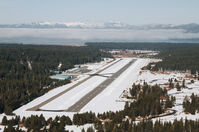  - South Lake Tahoe Airport facing NW with Lake Tahoe covered by fog just ahead of the airport. - by Chris Leipelt
