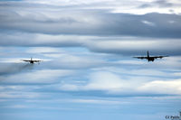  - Final approach to RAF Lossiemouth - Hercules C5 ZH881 leads a smoking Hercules C3 XV295 - by Clive Pattle
