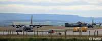  - Two RAF Hercules taxy on the airfield - by Clive Pattle