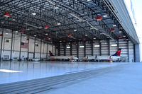  - Two Embraer ERJ 175LRs in the Skywest Maintenance hangar for final checks. Fresh from the factory in South America. Owned by Skywest, but flown under Delta colors. - by Gerald Howard
