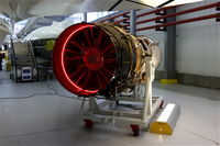  - Rolls Royce Olympus engine under the wing of a Concorde, at IWM Duxford. - by Graham Reeve