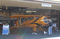  - First Sunday Aviation Museum of Santa Paula Featured Aircraft 1939 N100BU Bucker Jungmeister Angel with owner seated-right.  - by Doug Robertson