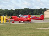  - nice pair of reds at Wautoma.
Nearest to camera a mystery aircraft!
If you know the N number please e-mail me!!! - by magnaman