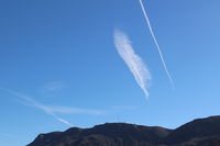  - Jet contrails over South Mountain of passenger jets enroute south-east bound to KLAX, Los Angeles International Airport - by Doug Robertson