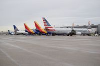  - Mid day flights in on south side of Concourse B. - by Gerald Howard