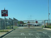  - A Learjet 36, N82GG, taxying through the level crossing gates over Wirraway Road, Essendon Airport. - by red750