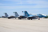  - F/A-18Cs of VMFAT-101 Sharpshooters, NAS Miramar, CA parked on the north GA ramp. - by Gerald Howard