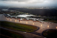  @ Brisbane International Airport - Low Res Overview of a dark and wet Brisbane International Airport YBBN taken during the dusk departure of QantasLink Shorts S360-300 VH-SUM, heading for Bundaberg YBUD on 16Jan2002. - by Walnaus47
