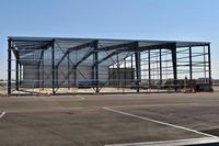  - Work on new hangar now has one side up. - by Gerald Howard